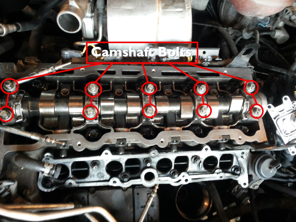 Removing valve cover and loosening camshaft bolts